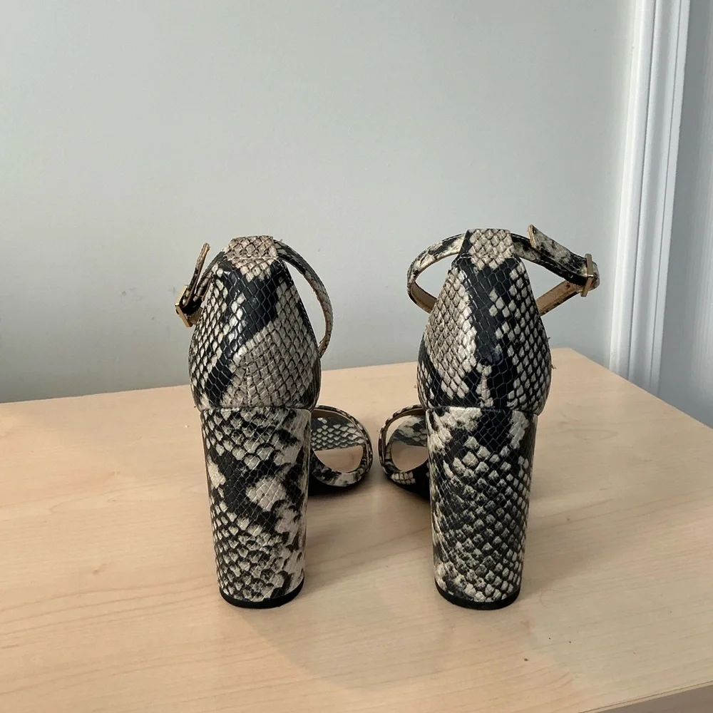 Francesca’s snake print embossed ankle strap heels